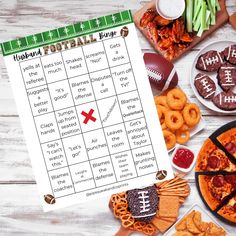 a football game is shown on a table with snacks and pretzels around it