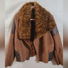 Donna Salyer's Fabulous Furs Suede Leather Moto Bomber Aviator Fur Winter Jacket Coat Size L Like New Minimally Worn; Less Than 5 Times No Damage Measurements In Pics True To Size Pit To Pit: 22" Made To Be Worn Open Can Style The Faux Fur Collar Different Ways. Super Warm And Cozy Gorgeous Camel Tan Color W Dark Brown Detailing Very Chic And Fashionable Look Posh Ambassador Ii Fast Shipping Smoke Free And Pet Free Home Fall Brown Biker Jacket With Padded Collar, Brown Long Sleeve Leather Jacket For Cold Weather, Brown Outerwear With Faux Fur Trim For Work, Brown Leather Jacket With Faux Fur Trim, Brown Leather Jacket With Faux Fur Lining For Work, Brown Biker Jacket With Faux Fur Trim For Fall, Fabulous Furs, Leather Moto, Faux Fur Collar