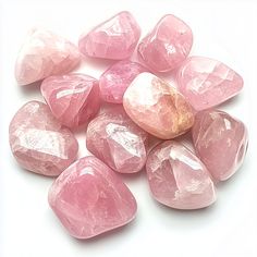 Small Group of Rose Quartz Tumbled Stones on a bright white background Spiritual Pink Crystals Gemstone, Pink Spiritual Gemstone Crystals, Pink Natural Stones Crystals For Healing, Pink Rose Quartz Crystals For Spiritual Use, Pink Rose Quartz Spiritual Crystals, Spiritual Pink Rose Quartz Crystals, Pink Healing Gemstone Crystals, Pink Rose Quartz Healing Crystals, Pink Rose Quartz Crystals For Gift