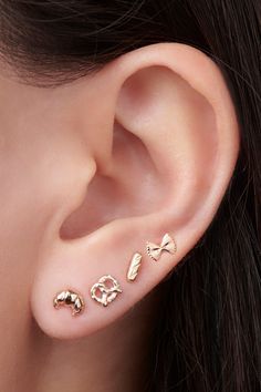 Freshly baked and ready to wear. Perfect for the bread lover in all of us, plus it's gluten-free ;) Gold Tragus Earrings, Flat Back Earrings Studs, Second Ear Piercing Classy, Tiny Ear Piercings, Jewelry Trends 2024, Macaron Earrings, Ear Stacks, Second Ear Piercing, Baguette Studs