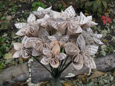 a vase filled with lots of paper flowers