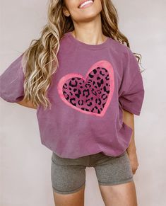 Hey you! I see you looking at this adorable leopard print heart shirt! Our heart t-shirt would be a cute and cozy gift for Valentines day. This trendy t-shirt is a unisex size Comfort Colors Tee. Reference the size chart in the photos for best fit. While this shirt has a relaxed fit, we recommend sizing up for an oversized look. Choose your t-shirt's color and size within the drop-down menu to the right.  *100% ring-spun cotton premium t-shirt *Soft-washed garment-dyed fabric *The dying process is unique and creates a vintage look. Please allow for slight color variation in production and washing. Washing instructions: Turn garment inside out. Machine wash cold. Remove promptly from the washer. Tumble dry on low heat setting. Do not iron the design. Our products are custom and made to orde Animal Print T Shirts, Valentines Day Shirt, Cozy Gift, Cute Heart, Heart Shirt, Comfort Colors Tee, Valentines Day Shirts, Animal Shirts, Trendy Tshirts