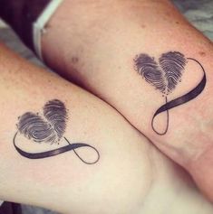 two people with matching tattoos on their legs, one has a fingerprint in the shape of a heart