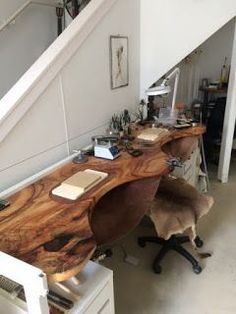 the desk is made out of wood and has an unusual shaped table top on it