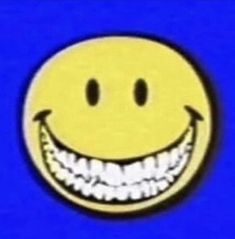 a smiley face with white teeth on a blue background