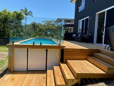 an above ground pool surrounded by wooden steps