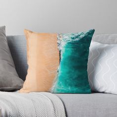 the ocean and beach are seen from above on this throw pillow, which features two different colors