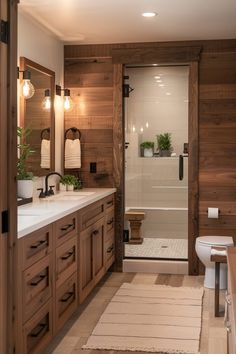 a bathroom with wood paneling and white fixtures on the walls, along with a large shower