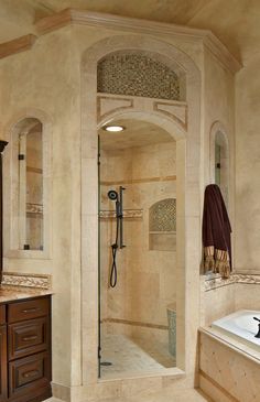 a bathroom with a walk in shower next to a sink