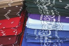 many different colored bandannas stacked on top of each other