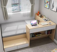 a small bedroom with a bed, desk and laptop on top of the shelf next to the window