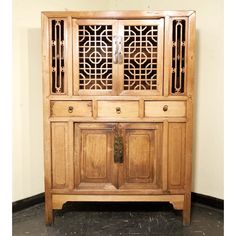 Scholar-Scroll Cabinet was a special piece of furniture in a scholar's study during Ming-Qing dynasty. Scholars might use the lower cabinet for storage of books and paintings; and use the open top cabinet to display their personal collections of jade, stone or snuff bottles etc. The top cabinet doors are decorated with open-carved "lattice and scroll" design. The doors are made with wooden hinge and can be easily removed. The cabinet is handcrafted and structured with wooden pegs and tenon struc Wooden Hinges, Low Cabinet, Ming Dynasty, Wooden Pegs, Scroll Design, Snuff Bottle, Asian Antiques, Qing Dynasty, Jade Stone