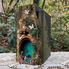 a small green door in the middle of a table