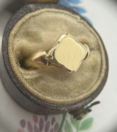 Antique 9 carat yellow gold seal/signet ring, the chubby diamond shaped face sits snugly between rounded and tapered shoulders. Full and crisp British hallmarks for London, 1971, makers AC.Co. The signet is in excellent condition with a thick and weighty feel, a strong shank and a beautifully clear face, perfect for engraving. The face is very pretty, a nice diamond shape with a scalloped like feel to the edging. The ring is a good size, with the face measuring approx. 1.2cm wide by 1cm high. Th Luxury Silver Antique Signet Ring, Diamond Shaped Face, Diamond Face Shape, Clear Face, Signet Rings, Ring Shapes, Diamond Shaped, Diamond Shape, Signet Ring