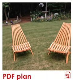 two wooden benches sitting on top of a lush green field