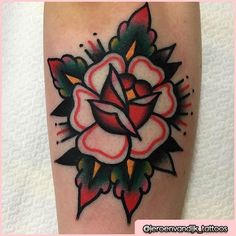 a tattoo on the leg of a person with a rose in it's center