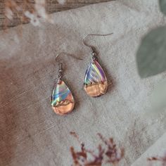 "Wooden earrings - Fifth anniversary gift for her With natural wood that looks like tiny mountains and a spectacular iridescent opal that looks like it could hold a galaxy inside.  The opal changes colors from all shades of blue/green to orange/red and more. With silver particles suspended in clear resin, that look just like tiny stars.   These dangle earrings make a great jewelry gift for her, and an even better five year anniversary gift for wife!   D E T A I L S * Made to order opal dangle ea Nature-inspired Teardrop Earrings For Gifts, Rose Gold Nature-inspired Earrings For Gift, Nature-inspired Rose Gold Earrings For Gift, Iridescent Teardrop Earrings For Gift, Iridescent Ear Wire Earrings For Gift, Hypoallergenic Nature-inspired Earrings As Gift, Hypoallergenic Nature-inspired Earrings For Gifts, Iridescent Nickel-free Earrings As A Gift, Rose Gold Hypoallergenic Teardrop Earrings For Gift