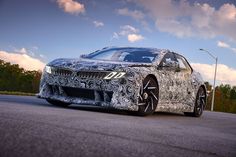 an all - new bmw z4 is shown in front of some trees and clouds