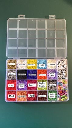 a plastic box filled with lots of different types of beads and seed mix in it