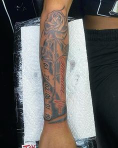 a person with a tattoo on their arm