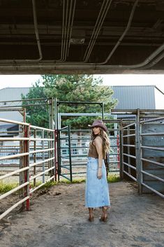 Description Dress up in denim with the Scottsdale Denim Maxi Skirt. An ankle length denim skirt with added edge, thanks to its off center front crease detailing and distinct highs and lows throughout the light wash. Pairs well with our "Urban Cowboy Denim Vest" Materials and Care 69% Cotton, 30% Organic Cotton, 1% Spandex. Machine wash cold water with like colors, no bleach, tumble dry low, cool iron. Hand Measured 24: Waist 12"(24), Length 33.5" 25: Waist 12.5"(25), Length 33.5" 26: Waist 13"(2 Long Denim Skirt With Cowboy Boots, Skirt With Cowboy Boots, Cowboy Denim, Urban Cowboy, First Move, Long Denim Skirt, Iron Hand, Denim Maxi, Skirt Jumpsuit