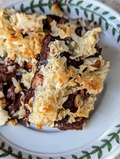 a white plate topped with chocolate and coconut bars