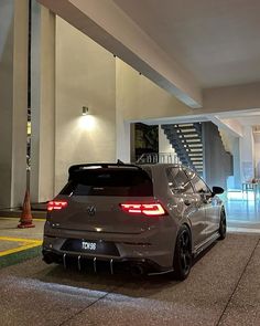 the rear end of a gray volkswagen golf gtr