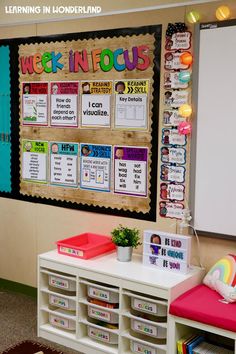 a bulletin board in the corner of a classroom