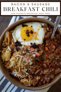 bacon and sausage breakfast chili in a bowl with an egg on top