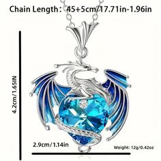 a blue crystal heart shaped necklace with an eagle on the front and wings above it