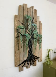 a wooden wall hanging with a tree on it