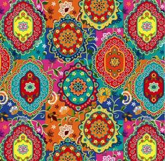 an abstract colorful background with many different colors and designs on it, including circles in the center