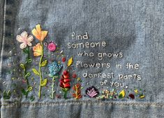 embroidered quote on jean jacket saying find someone who grows flowers in the deepest parts of you