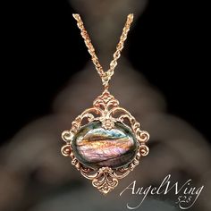 A 22x28mm oval Labradorite cabochon with a scintillating array of purple, copper, yellow, green and blue is the star of this ornate, gleaming gold brass pendant. A beautiful piece for those who love the opulent richness of bygone eras.  This lovely labradorite will reflect multiple colors as it catches the light.  Encased in well detailed brass stampings, the pendant itself measures 2 inches long by 1 1/2 inches wide. The gold-plated chain has a total length of 28 inches which includes a 2 1/2 i Bridgerton Style, Purple Flash, Pearl Drop Necklace, Labradorite Cabochon, Labradorite Jewelry, Beaded Pendant Necklace, Labradorite Necklaces, Jewelry Tree, Silver Jewelry Handmade