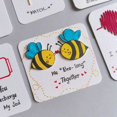 some cute little magnets that are on top of a computer keyboard and the words we bee - long together