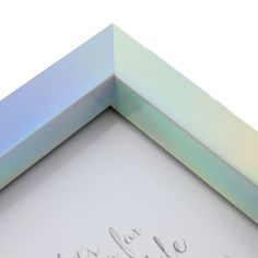 a close up of a white and blue frame with writing on the bottom half of it