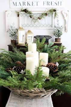 a basket filled with pine cones and candles