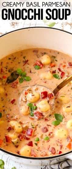 creamy basil parmesan gnocchi soup in a white bowl with a spoon