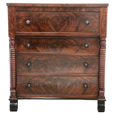 an antique chest of drawers with four drawers and two pulls on each drawer, in walnut