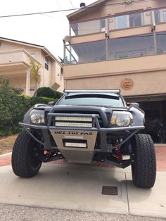 a large truck parked in front of a house