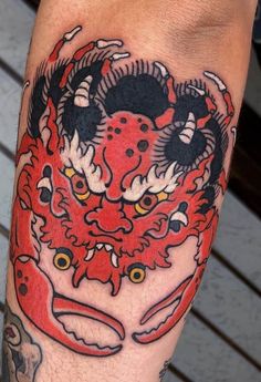 a close up of a person with a tattoo on his leg