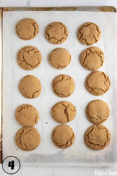 twelve cookies on a baking sheet ready to be baked