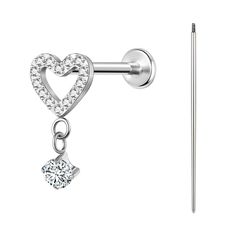 a pair of heart shaped earrings with crystal stones hanging from the end of a bar