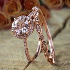 two rose gold wedding rings with diamonds on the top and one diamond in the middle