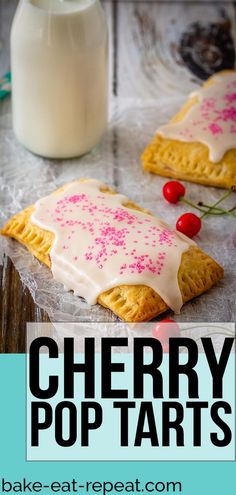 cherry pop tarts with white frosting and sprinkles on them, sitting next to a bottle of milk