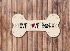 a dog bone with the words live love bark on it