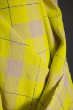 a yellow and white checkered fabric is shown