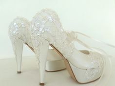 "Ivory lace embellished wedding shoes for bride, custom heel heights available. Vintage weddings or elegant receptions, these wedding heels compliment your wedding dress beautifully! Custom wedding gift, bachelorette gift, personalized engagement gift. Ivory satin bridal shoes are designed with embroidered lace. Glass beads, shiny sequins and small pearls are used on the embroidery and organza ribbons tie on the front. They are made of soft smooth satin and delicate lace, each handmade item is u Elegant Lace Wedding Shoes With Laces, Elegant Wedding Shoes With Laces For Ceremony, Elegant Laced Wedding Shoes For Ceremony, Elegant Lace Wedding Shoes For Ceremony, Elegant Wedding Shoes With Laces, Elegant Wedding Shoes With Lace Trim, Elegant Wedding Heels With Lace Trim, Elegant Wedding Shoes With Lace Work, Evening Lace Wedding Shoes With Lace Trim