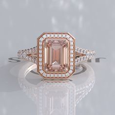 an engagement ring with a large pink diamond surrounded by small white and light brown diamonds