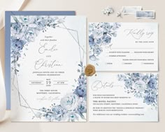 wedding stationery with blue flowers on it